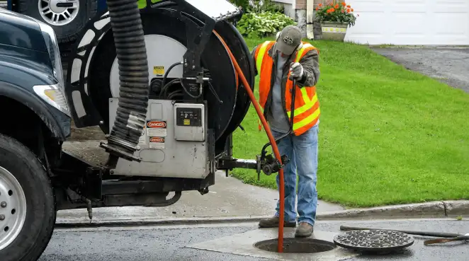 Technician using specialized drainage equipment for sewer line cleaning and foundation protection in Duluth, MN