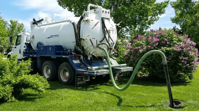 Professional vacuum truck performing residential drainage and septic maintenance in Duluth, MN